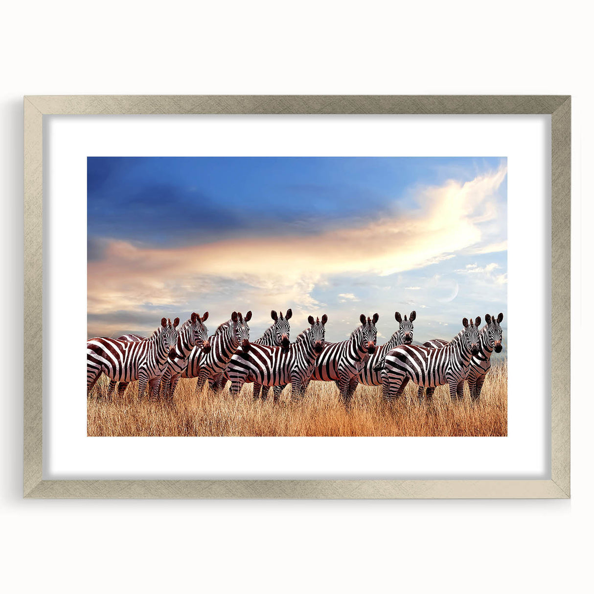 Textured art print of abstract African scenery in muted earth tones, framed in silver, ideal for bedroom decor.