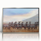 Mid-century modernist art depicting Tanzanian scenery in earth tones on a silver-framed acrylic print.