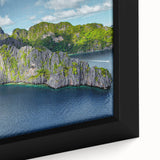 Black wall art featuring a textured, colorful depiction of a Philippine landscape on a framed canvas.
