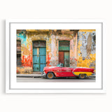 Textured abstract art print depicting a Caribbean scene in muted blues and greens on a framed white mat.