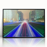 Large abstract wall art depicting a European cityscape in muted gray and black tones, acrylic print framed in black.