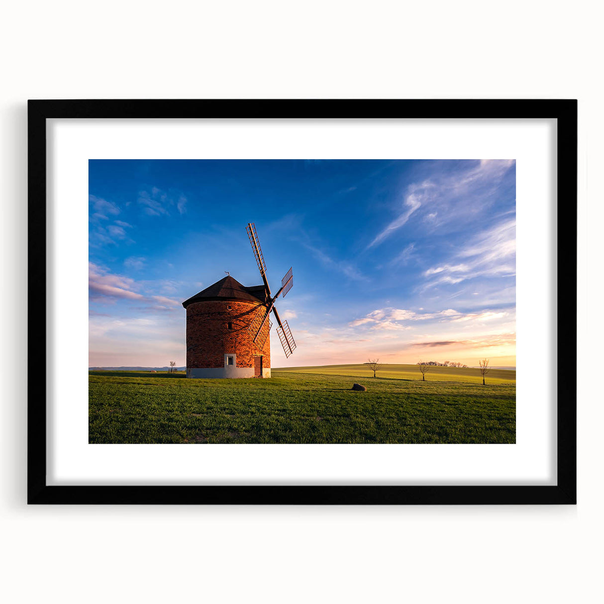 Colorful abstract art print of a European cityscape in vibrant hues on a large framed canvas, suitable for living room decor.