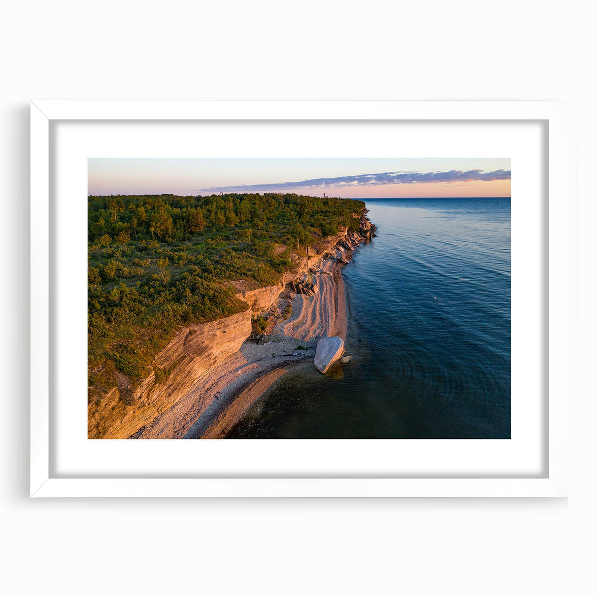 Textured abstract art print depicting a serene European landscape in muted green and blue tones, framed with a white mat.
