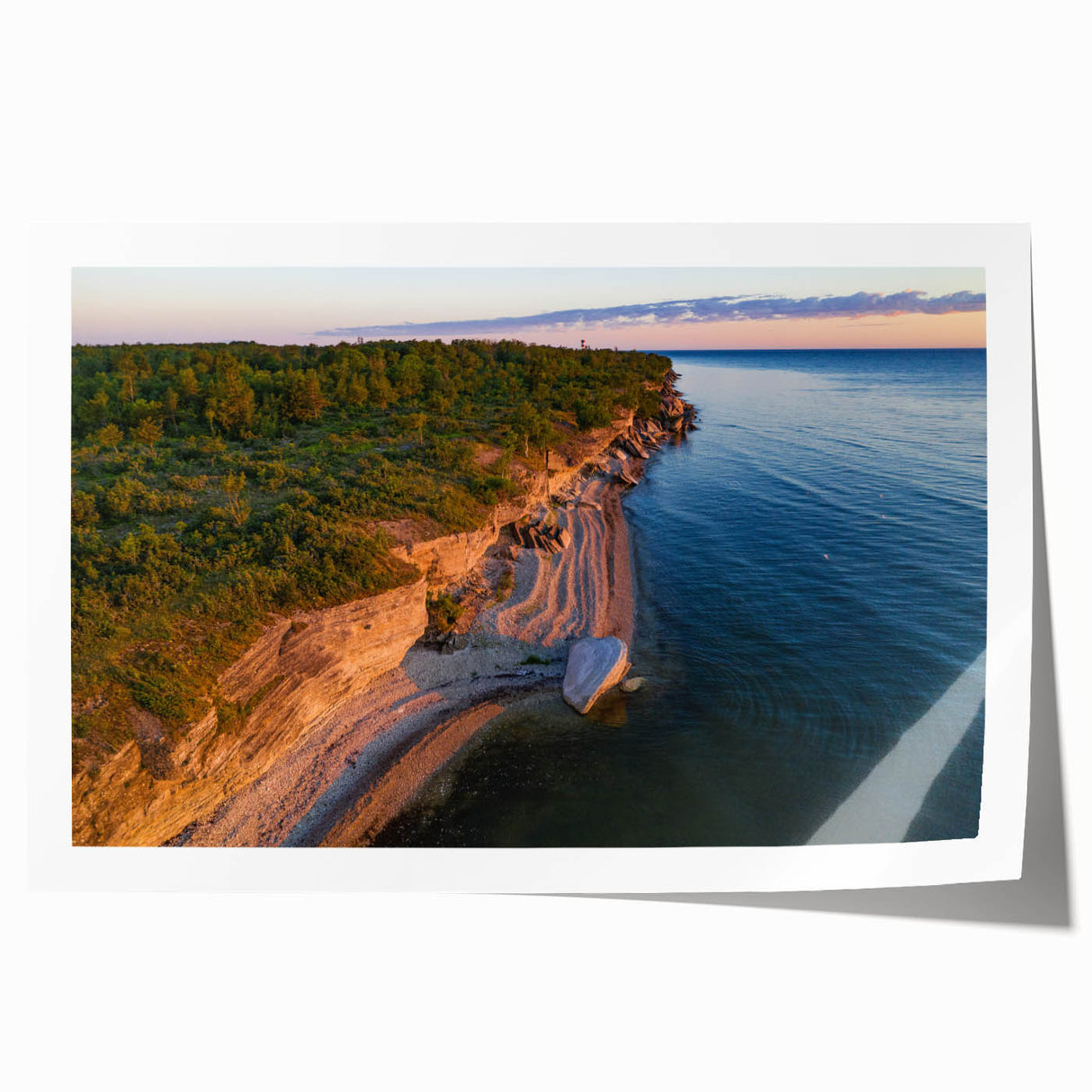 Rolled print of a serene European landscape with floral foreground in soft pastel colors.