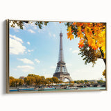 Framed vintage poster art of a Paris landscape on canvas, featuring muted gold and black tones, ideal for bedroom wall decor.