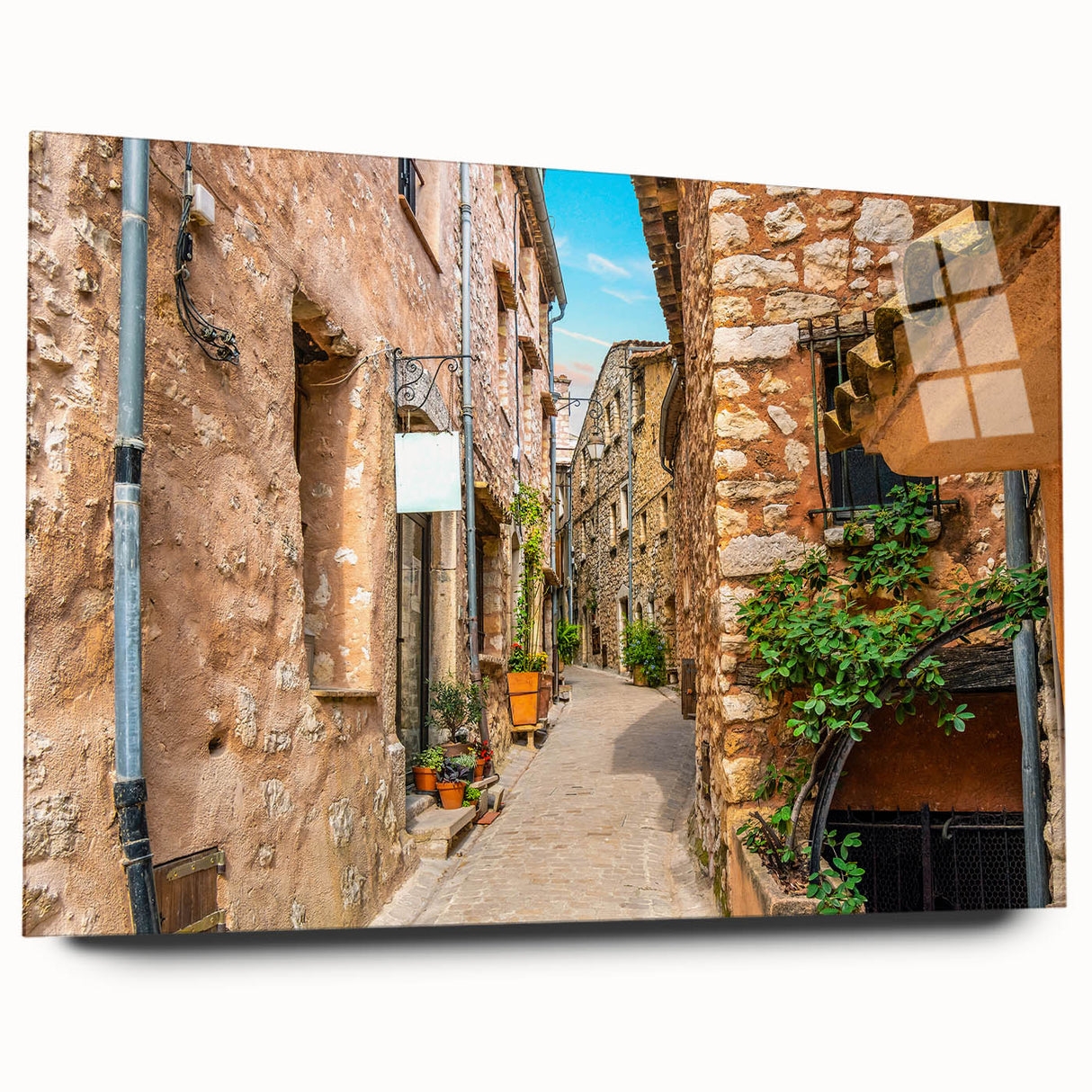 Large abstract wall art of a South France scenery in muted blue and green tones on acrylic glass.