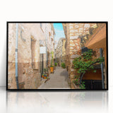 Large abstract wall art depicting a vibrant European scenery in mid-century modernist style, framed in black acrylic.