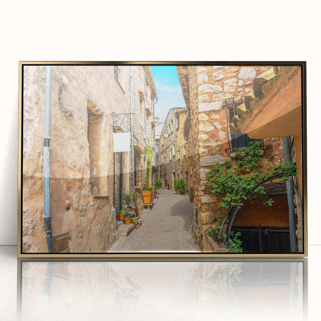Art Deco poster of a Southern France scenery in muted gold and blue tones, acrylic framed, suitable for modern nursery decor.
