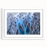 Abstract art print of an Icelandic landscape in muted gray and blue tones on a framed white mat, ideal for dining room decor.