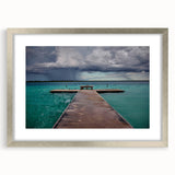 Textured art depicting abstract scenery in Quintana Roo with muted earth tones on a framed silver mat, ideal for bedroom art.