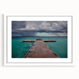 Abstract art print featuring vibrant blues and greens of Quintana Roo scenery on a white-framed mat.