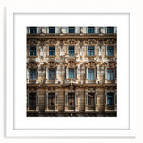 Abstract art print depicting a stylized Saudi Arabian landscape in muted earth tones, framed with a white mat.