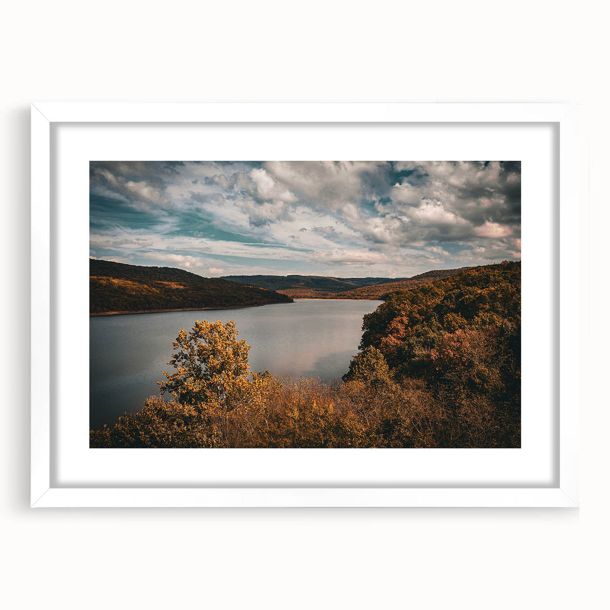 Abstract art print of Arkansas scenery in muted earth tones on a framed white mat, suitable for dining room decor.