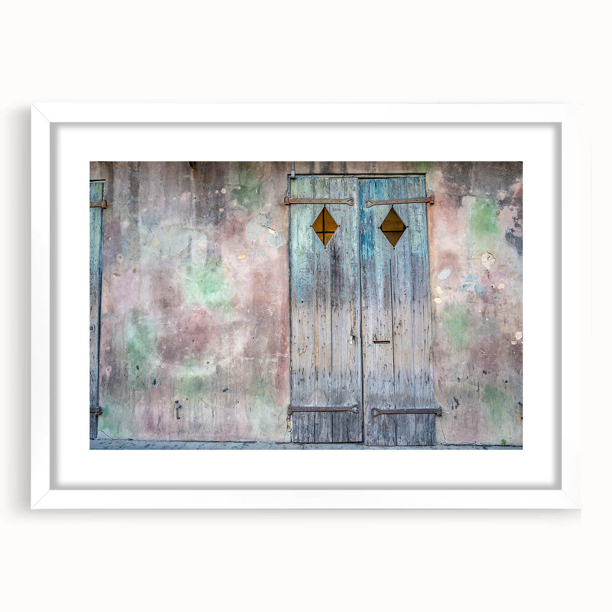 Abstract art print of New Orleans scenery in muted earth tones on a framed white mat, suitable for dining room decor.