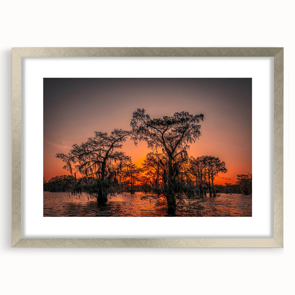Textured art of abstract Louisiana scenery in muted earth tones, framed in silver, suitable for bedroom decor.