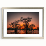 Textured art of abstract Louisiana scenery in muted earth tones, framed in silver, suitable for bedroom decor.