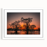 Abstract art print of Louisiana scenery in muted earth tones on a white framed mat, suitable for dining room decor.