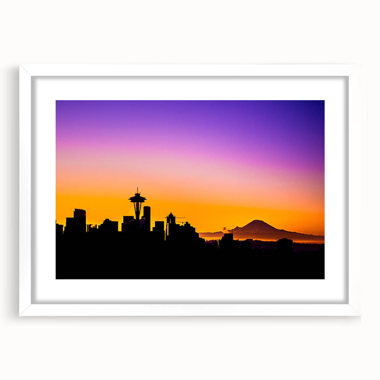 Abstract art print of Seattle skyline in muted gray and blue tones on a framed white mat.