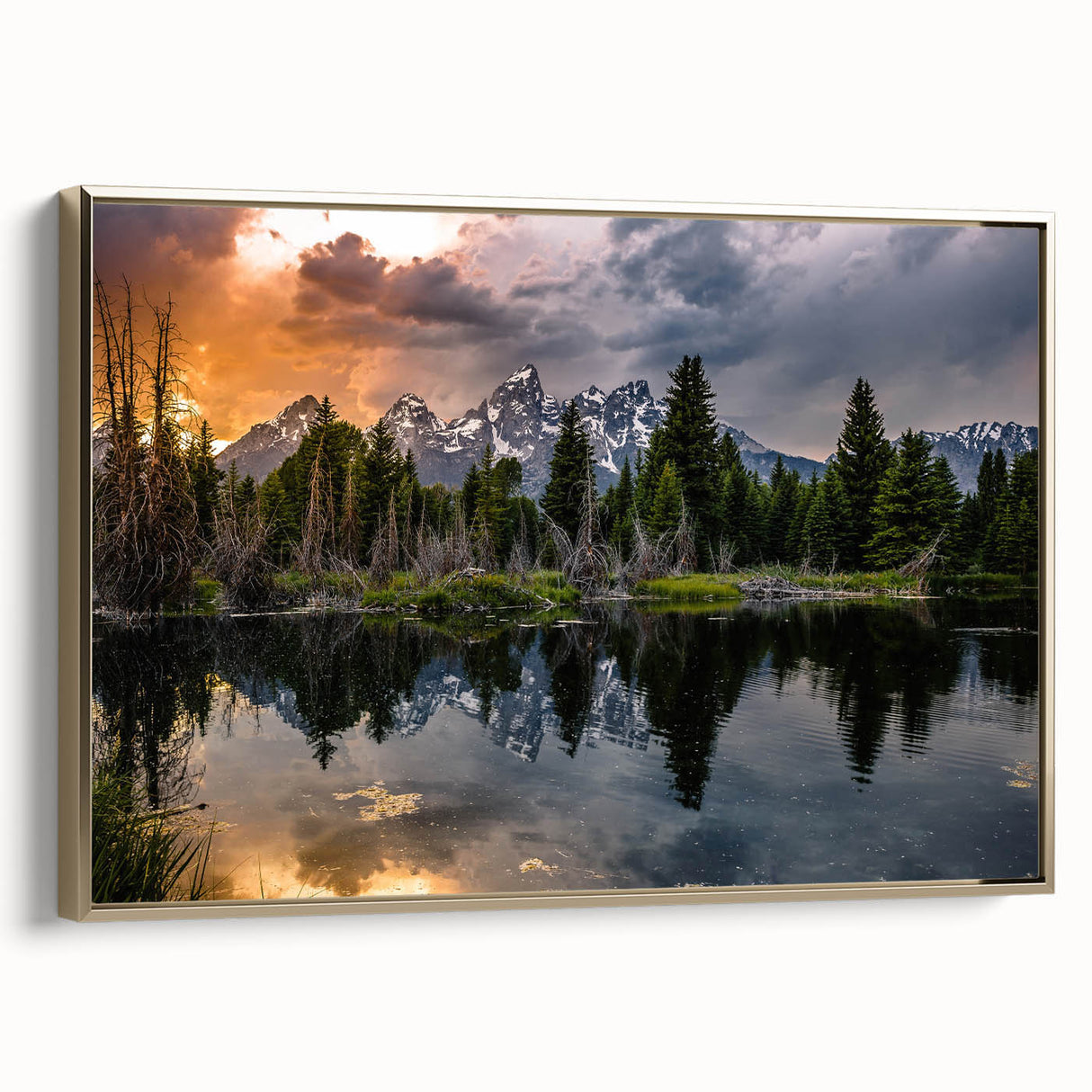 Framed canvas depicting the Grand Tetons in Wyoming with a vintage poster art style, using black and gold tones.