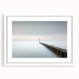 Abstract landscape artwork framed in a sleek white mat, showcasing a vibrant blend of colors and shapes, perfect for modern home decor or office spaces.