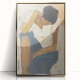 Framed acrylic artwork featuring an abstract figurative design with gold accents, showcasing a modern artistic style suitable for contemporary home decor.
