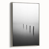 Framed canvas artwork showcasing an abstract landscape in soothing tones of blue and green, set against a sleek silver frame, ideal for modern home decor.