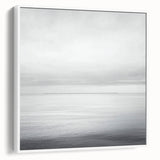 Abstract landscape framed canvas artwork showcasing a serene blend of soft blues and greens, elegantly displayed in a white frame, perfect for modern home decor.