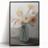 Framed acrylic artwork featuring vibrant abstract floral designs in shades of blue, pink, and green, set against a sleek black frame, perfect for modern home decor.