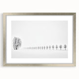Abstract landscape artwork framed in a silver mat, showcasing soft hues of blue and green, perfect for modern home decor. This elegant piece adds a touch of sophistication to any room.