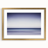 Abstract landscape art framed in gold with a white mat, showcasing soft hues of blue and green, ideal for modern home decor.