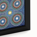 Close-up view of an abstract geometric framed canvas artwork showcasing vibrant blue and orange shapes, perfect for modern home decor and artistic interiors.
