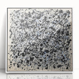 Framed acrylic artwork featuring vibrant abstract splatters in shades of blue, yellow, and red, displayed against a sleek white background, ideal for modern decor.