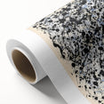 Abstract splatter art design on rolled canvas showcasing vibrant colors and dynamic patterns, ideal for modern home decor. Packaged securely in a cardboard tube for delivery.