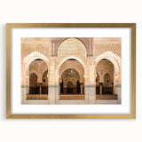 Abstract textured art print of Moroccan scenery in muted earth tones, framed in gold, ideal for bedroom wall decor.