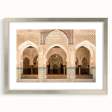 Abstract art print of a Moroccan landscape in muted earth tones on a framed silver mat, ideal for dining room decor.