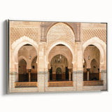 Vintage poster art of a Moroccan landscape on a framed canvas, featuring vibrant colors against a black background.