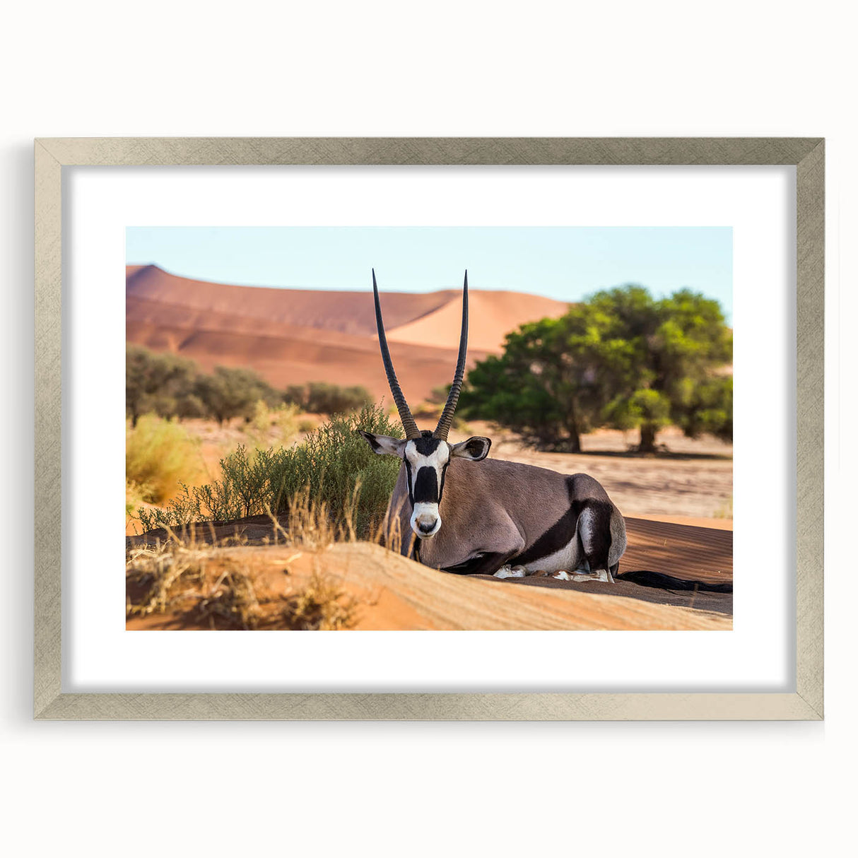 Abstract art print depicting a serene Namibian landscape in muted earth tones on a framed silver mat.