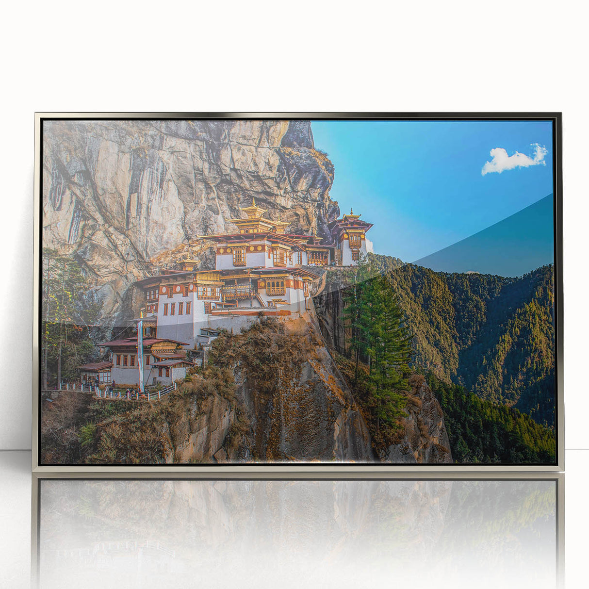Mid-century modernist art depicting the Bhutanese landscape in muted earth tones on a silver-framed acrylic print.
