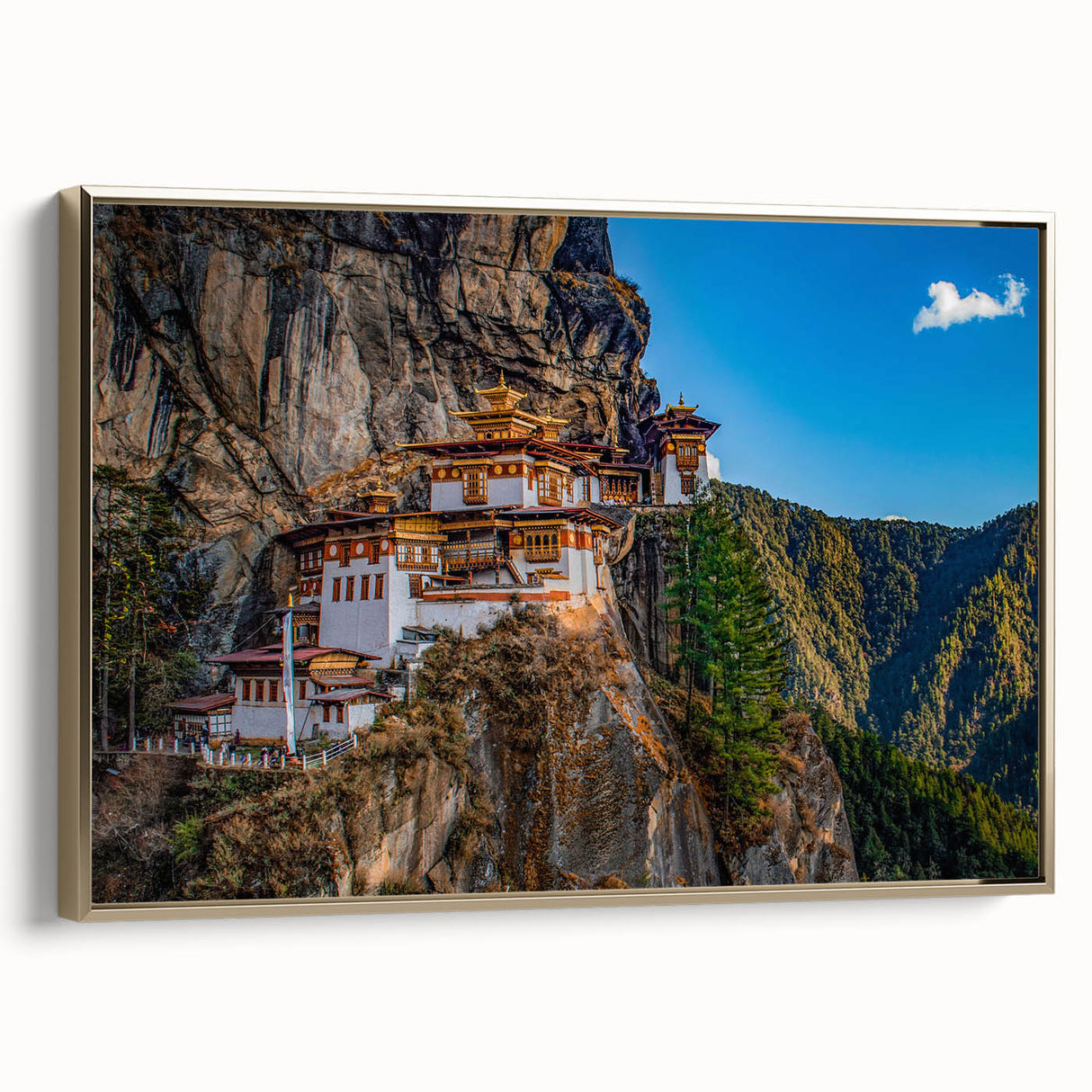 Framed canvas depicting a vintage-style landscape of Bhutan in muted gold and black tones, ideal for bedroom wall art.