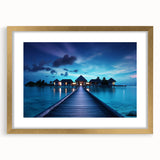Extra large abstract art print of a serene Maldivian seascape in muted blue and green tones, framed in gold.