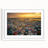 Textured abstract art print depicting a Caribbean scenery in vibrant blue and green tones, framed with a white mat.
