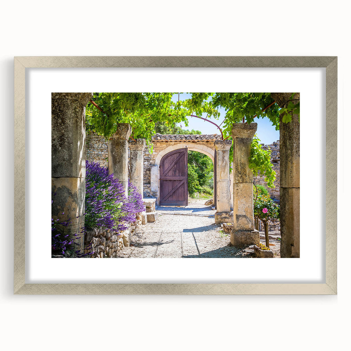 Textured art print of abstract Provence scenery in muted earth tones, framed in silver, ideal for bedroom art.