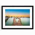 Abstract art print of a colorful European scenery in vibrant hues, textured on a large black-framed canvas.
