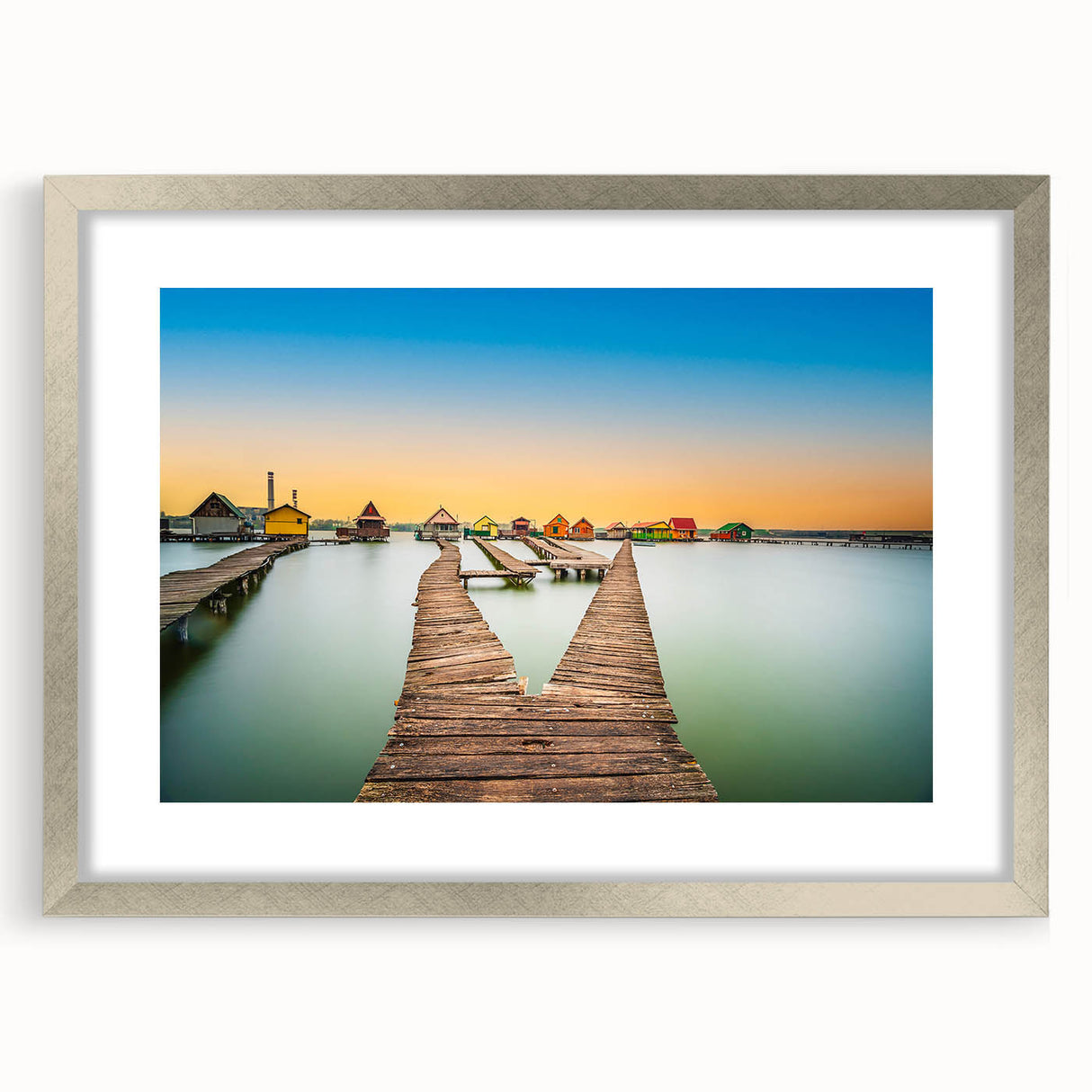 Extra large abstract art print of a textured European scenery in muted earth tones, framed in silver.