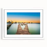 Textured abstract art print of a European scenery in muted earth tones, framed with a white mat, suitable for bedroom decor.