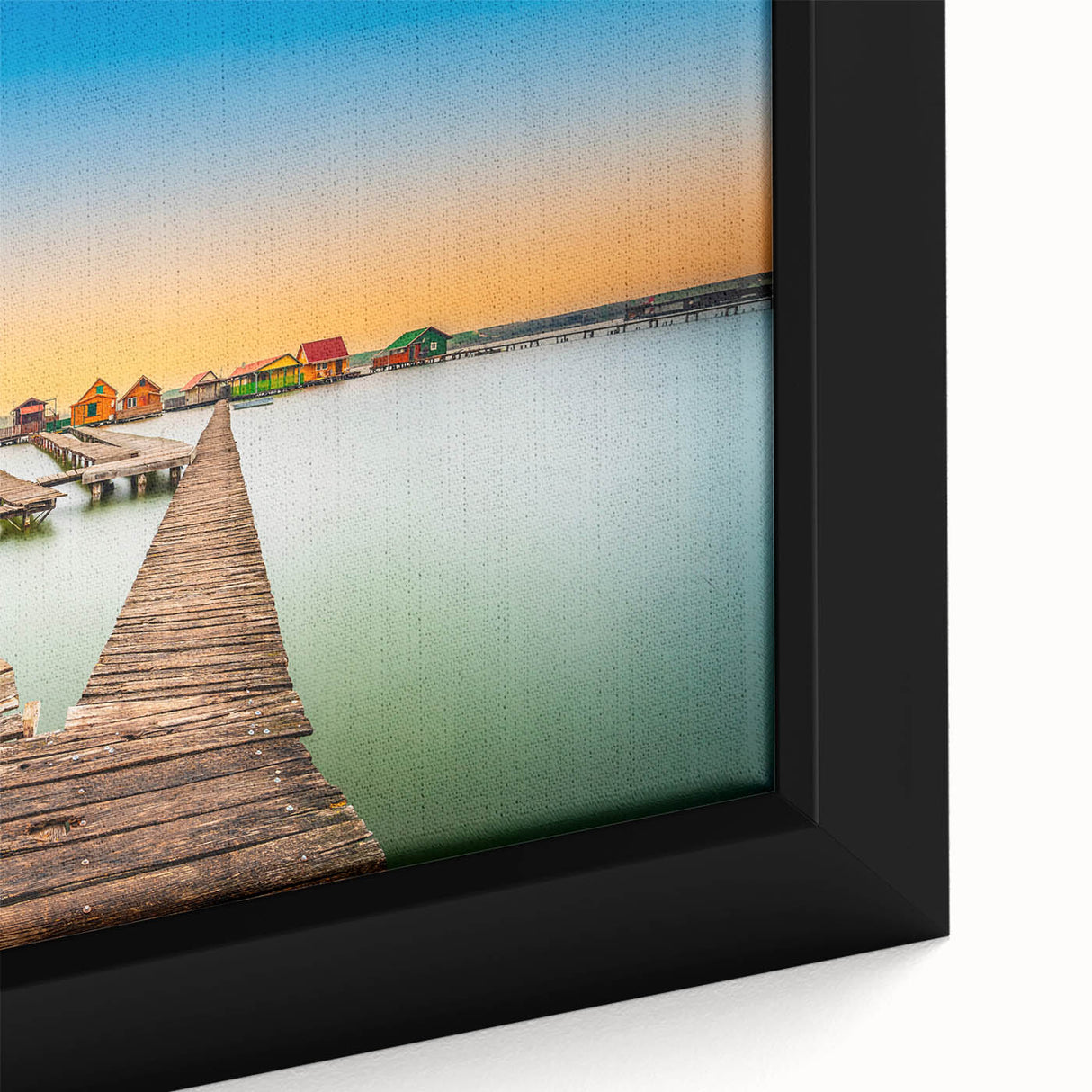 Framed canvas of a textured European scenery in black with colorful accents, ideal for living room decor.