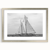 Extra large abstract art print of a textured Barcelona scenery in muted earth tones, framed in silver.