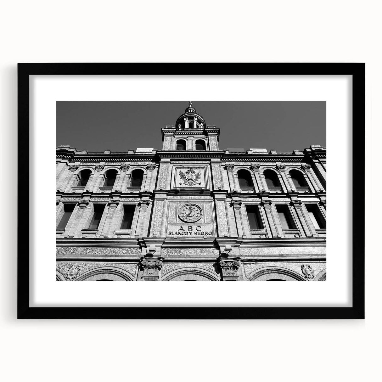 Extra large abstract art print of Madrid with vibrant, colorful textures on a black framed canvas.