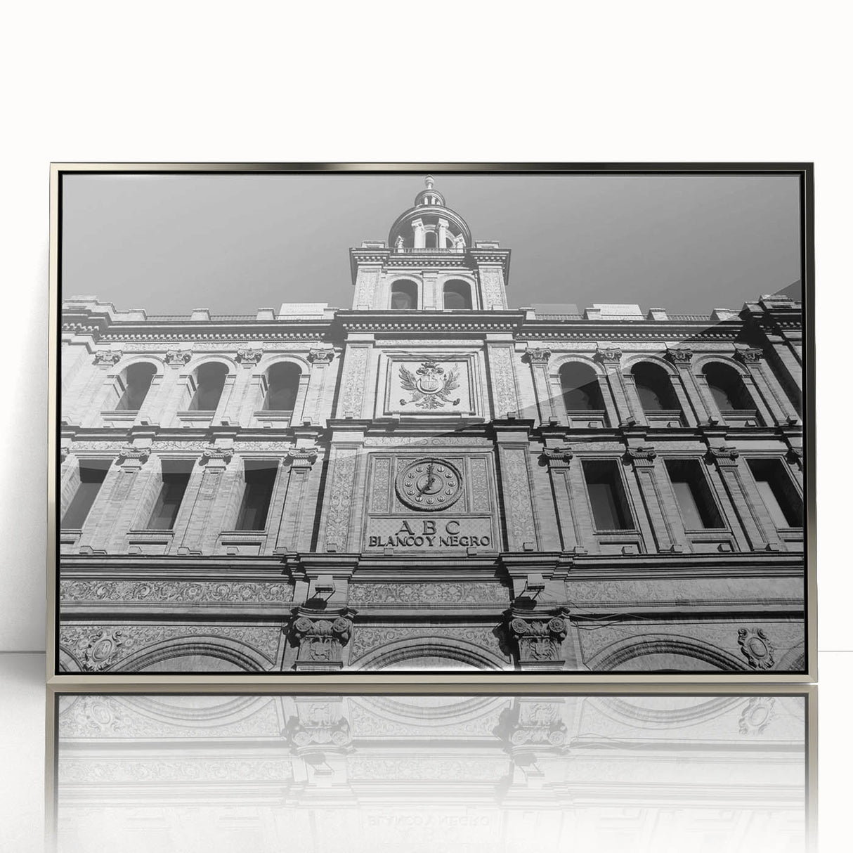 Mid-century modernist art of Madrid skyline in muted earth tones on a silver-framed acrylic print.