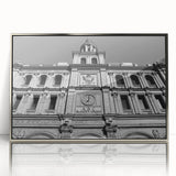 Mid-century modernist art of Madrid skyline in muted earth tones on a silver-framed acrylic print.